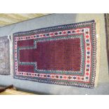 Two 20th Century prayer rugs and a another rug