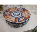 Pair of Chinese white glazed Dogs of Fo and 6 Japanese Imari plates