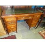 Edwardian mahogany pedestal desk with green leather top and drawers with brass pulls