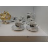 A part teaset advertising Hendricks gin containing a tea pot and 6 cups and saucers boxed