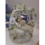 A 19th century Staffordshire group of lovers Besfath a folate arbour 23cm high