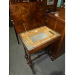 A mahogany and walnut sewing table