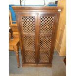 Indian hardwood cabinet with pierced decoration to the door panels