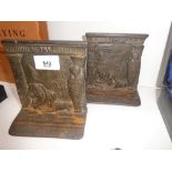 A pair of cast iron Egyptian revival bookends with high relief detail, Early 20th century, 13.5cm