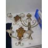 A brass two sconce wall light and a smaller pair of wall lights
