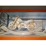 Wooden child’s rocking bike