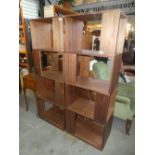 A pair of modern open bookcases