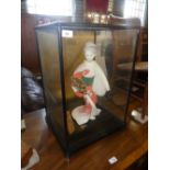 Model of a Geisha displayed in a glass and ebonised case