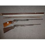 Two antique air rifles, a tribal spear and a French telescopic measuring rod