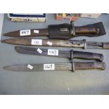 Four various Bayonets: two with scabbards missing