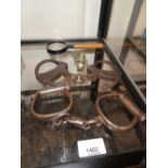 Two pairs of antique handcuffs, a Metropolitan Police Whistle and magnifying glass