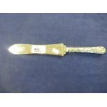 Chinese white coloured metal knife with embossed dragon handle, engraved dragon to the blade,