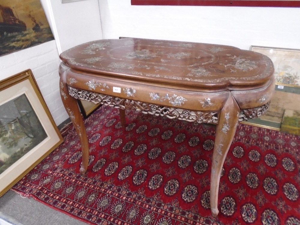 A Japanese Shibayama Mother of Pearl centre table having carved fretwork frieze, 109cms