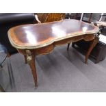 A 19th century French Kingwood and Rosewood writing table having one central drawer with shaped top,