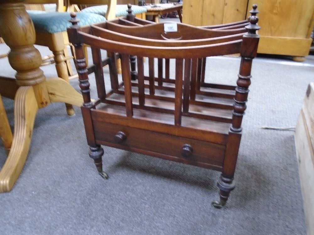 A Victorian rosewood canterbury having one drawer on turned legs 46cms