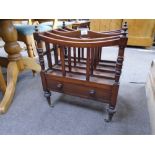 A Victorian rosewood canterbury having one drawer on turned legs 46cms