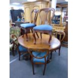 A Victorian mahogany oval loo table on carved tripod base 142cms and a set of four Victorian