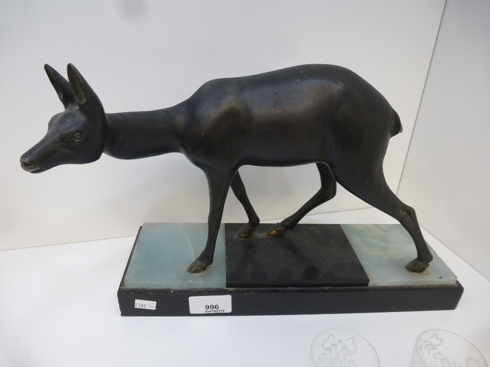 Irene Rochard- French Art Deco; spelter model of a deer mounted on a stepped marble base, 33cm long,
