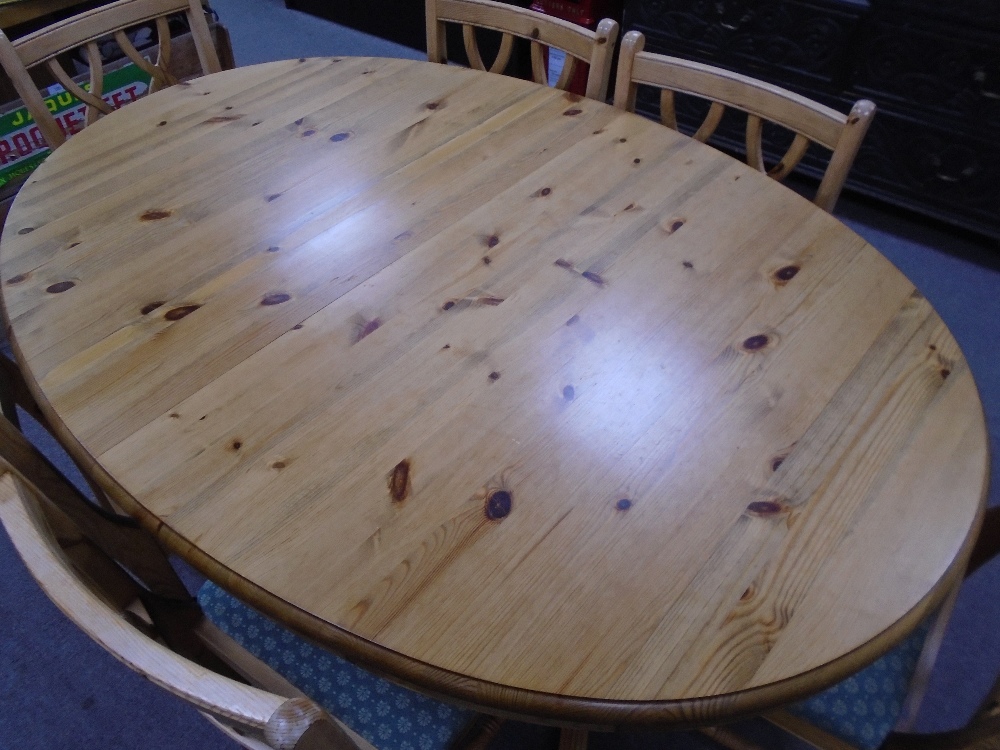 A Ducal pine oval dining table with concelled leaf and a set of eight Ducal dining chairs to include - Image 2 of 3