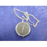 Henning Koppel stainless steel pendant watch by Georg Jensen on a white coloured metal neckchain,