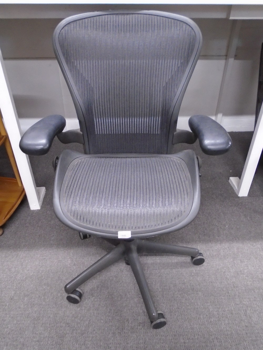 A Herman Miller Aeron desk chair B8, with adjustable settings