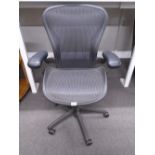 A Herman Miller Aeron desk chair B8, with adjustable settings