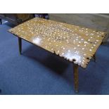 An Ottoman style inlaid rectangular coffee table on turned splay legs 106.5cms