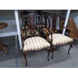 A set of 6 Edwardian mahogany saloon chairs having pierced splats on cabriolet legs