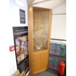 An ercol light elm and beech corner cabinet & cupboard; glazed top hal with 2 glass shelves and