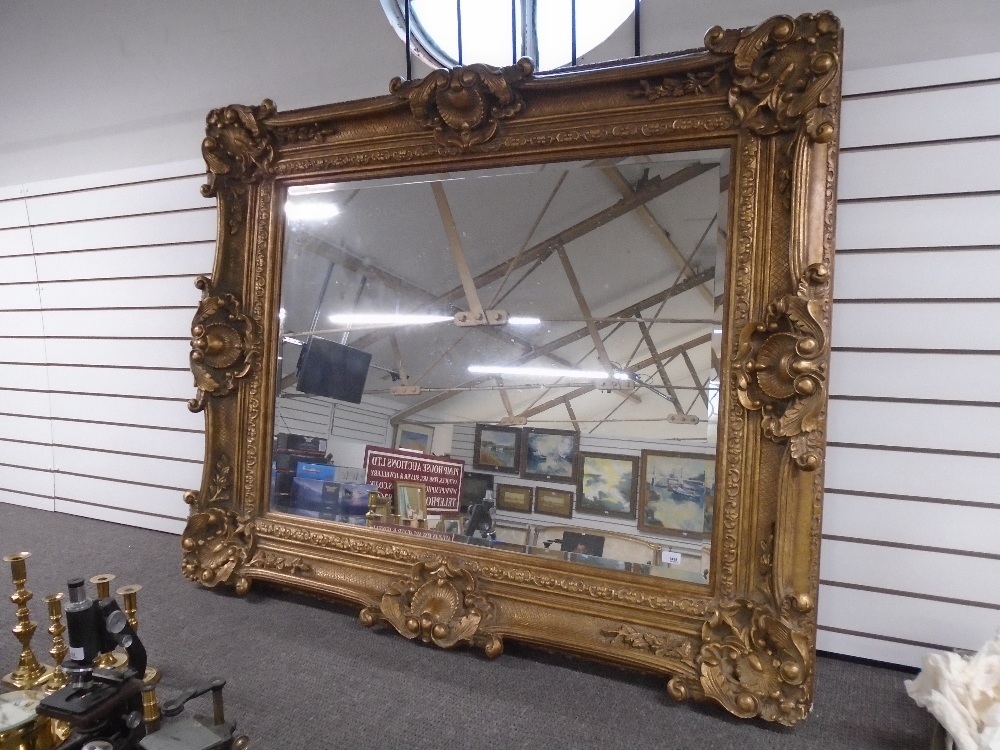 Large modern gilt frame mirror with ornate frame