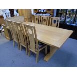 Contemporary oak refectory table and a set of six oak dining chairs by