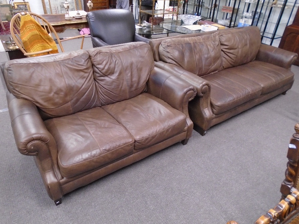 Two and three seat brown leather sofa