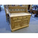 Old stripped pine wash stand having tiled back with 2 drawers and cupboards below, 104.5cm