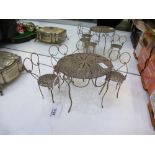 Continental white metal coloured metal dolls house table and 4 chairs, fillagree work, table 11cm