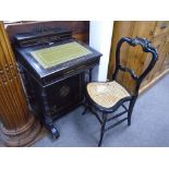 Victorian ebonised Davenport having gilt decoration and a cane seated chair