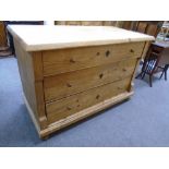 Old Continental pine ch having three long drawers on bun feet, 125cm