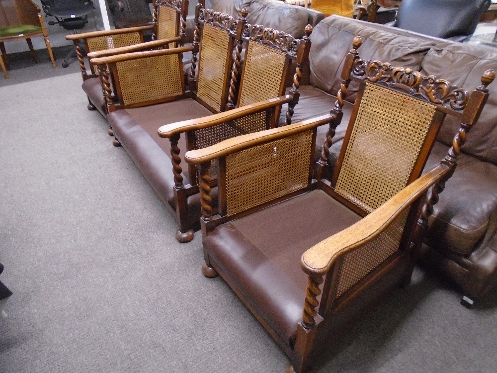 A pair of 1930's oak bergere armchairs and matching two seat settee with barley twist supports and - Image 2 of 4