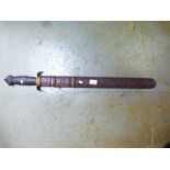 Ornamental Chinese sword in carved wooden scabbard