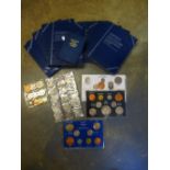 Quantity of GB coin sets including a 3 pence silver collection.