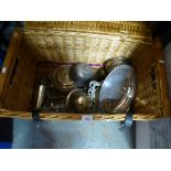 Wicker basket containing a quantity of silver plate