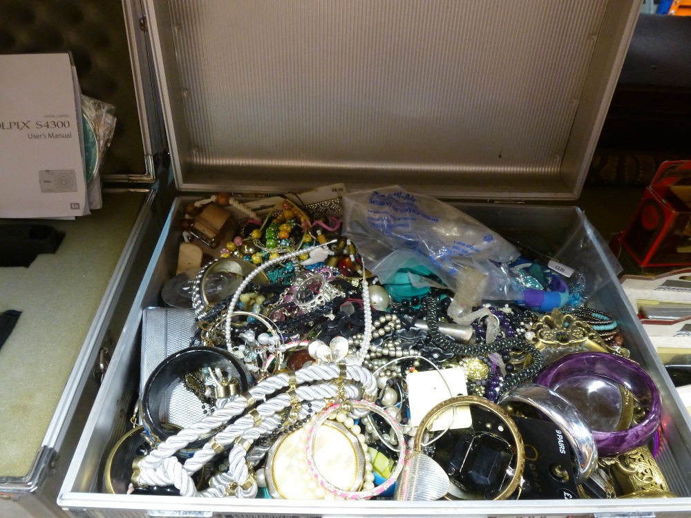 Aluminium case containing costume jewellery