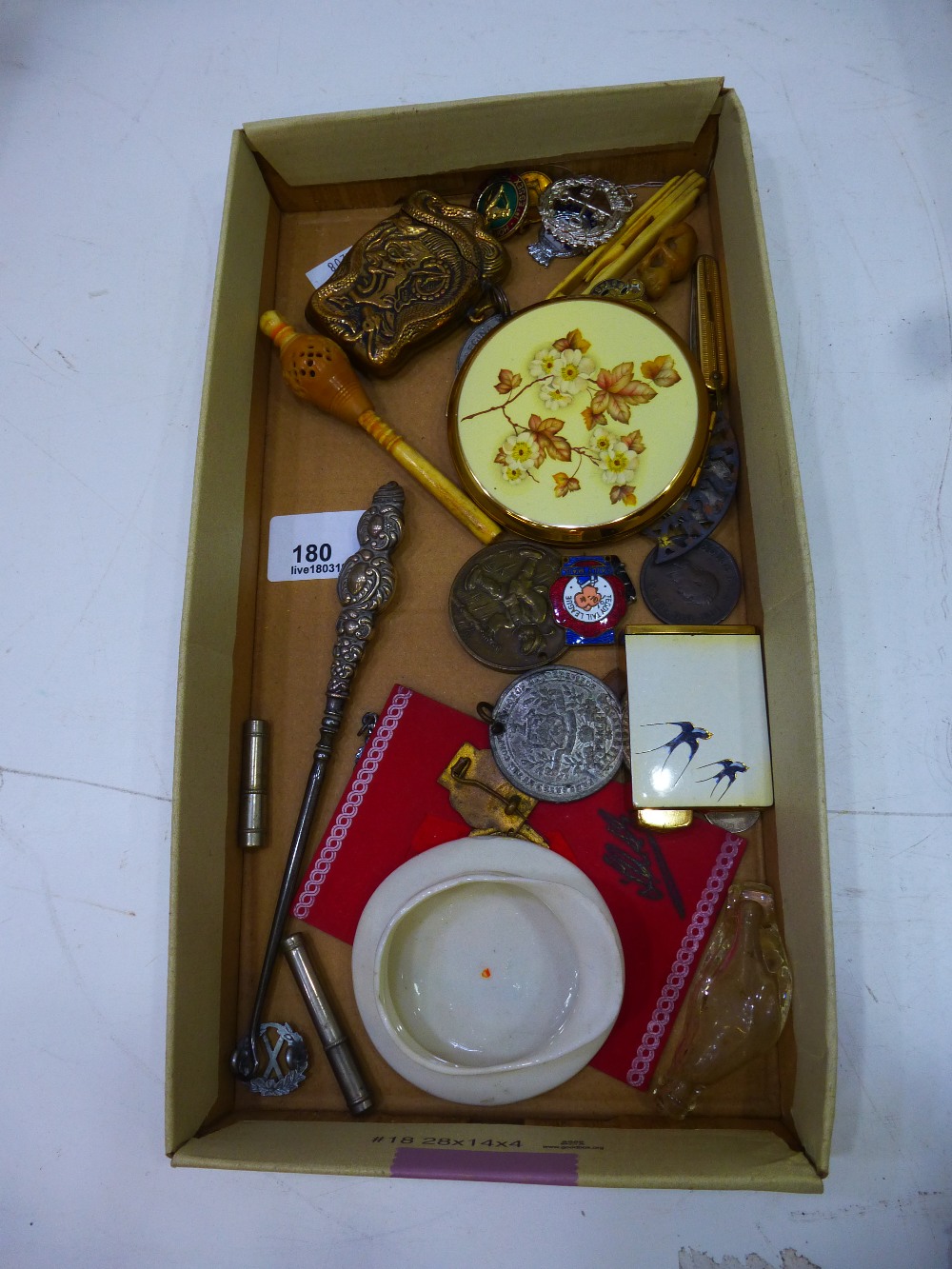 Small collection of collectables incl. button hook, carved rattle, badges, brass matchbox, lead