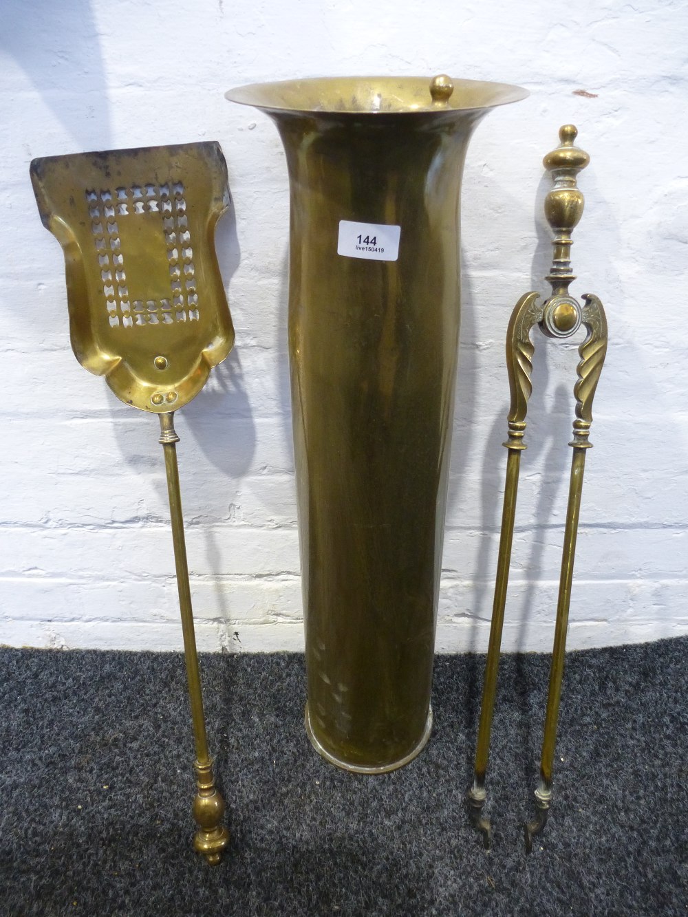 Military WWII shell converted into an umberella stand with tongs etc.