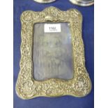 Edwardian silver fronted photograph frame with embossed decoration including birds, Birmingham 1904,