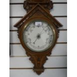 A Victorian carved oak barometer thermometer 96cms