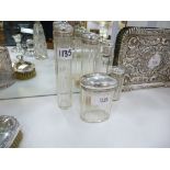 5 George V glass toilet jars, the silver lids engraved with cr and initials, London 1911, total