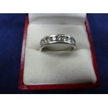 18ct White gold half eternity ring channel set, with a 9 brilliant cut diamonds, shank stamped