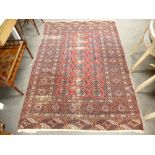 A small Bokhara carpet, red ground 191 x 130cms