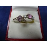 9ct Yellow gold ring set centre pink coloured stone flanked to either side with a diamond, stamped