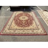 A modern Turkish Tabriz style carpet having allover flower design 330 X 240cms